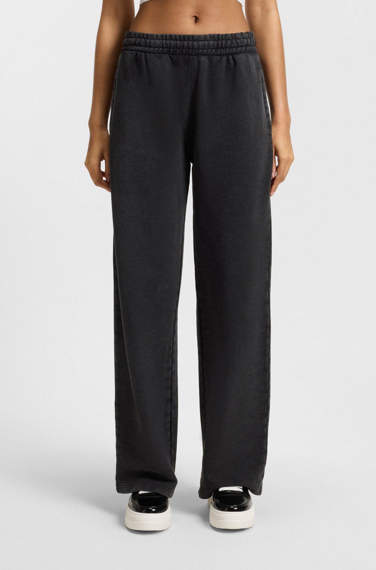 HUGO - Loose-fit tracksuit bottoms in cotton terry - Black Product Image