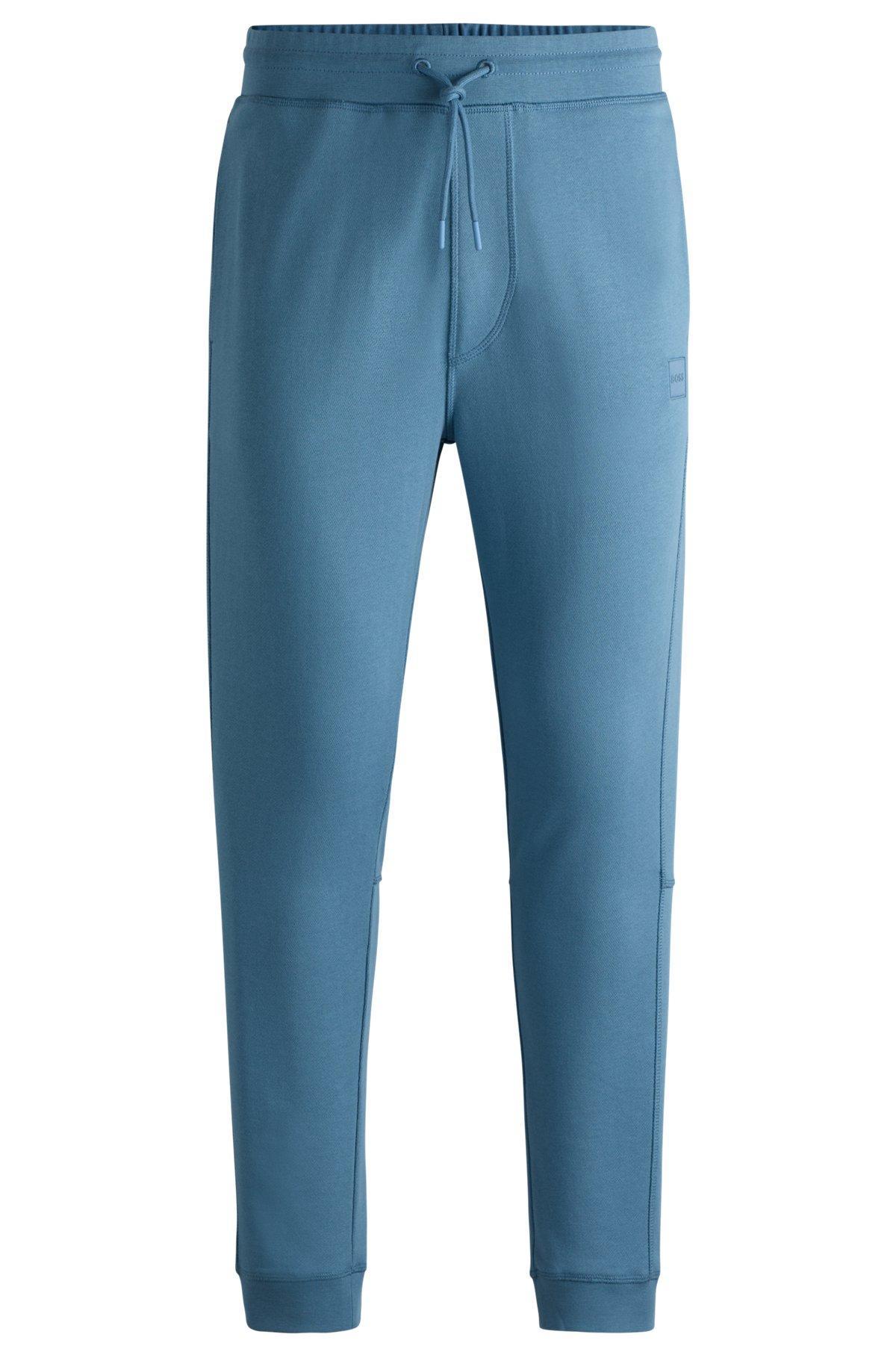 Cotton-terry tracksuit bottoms with logo patch Product Image