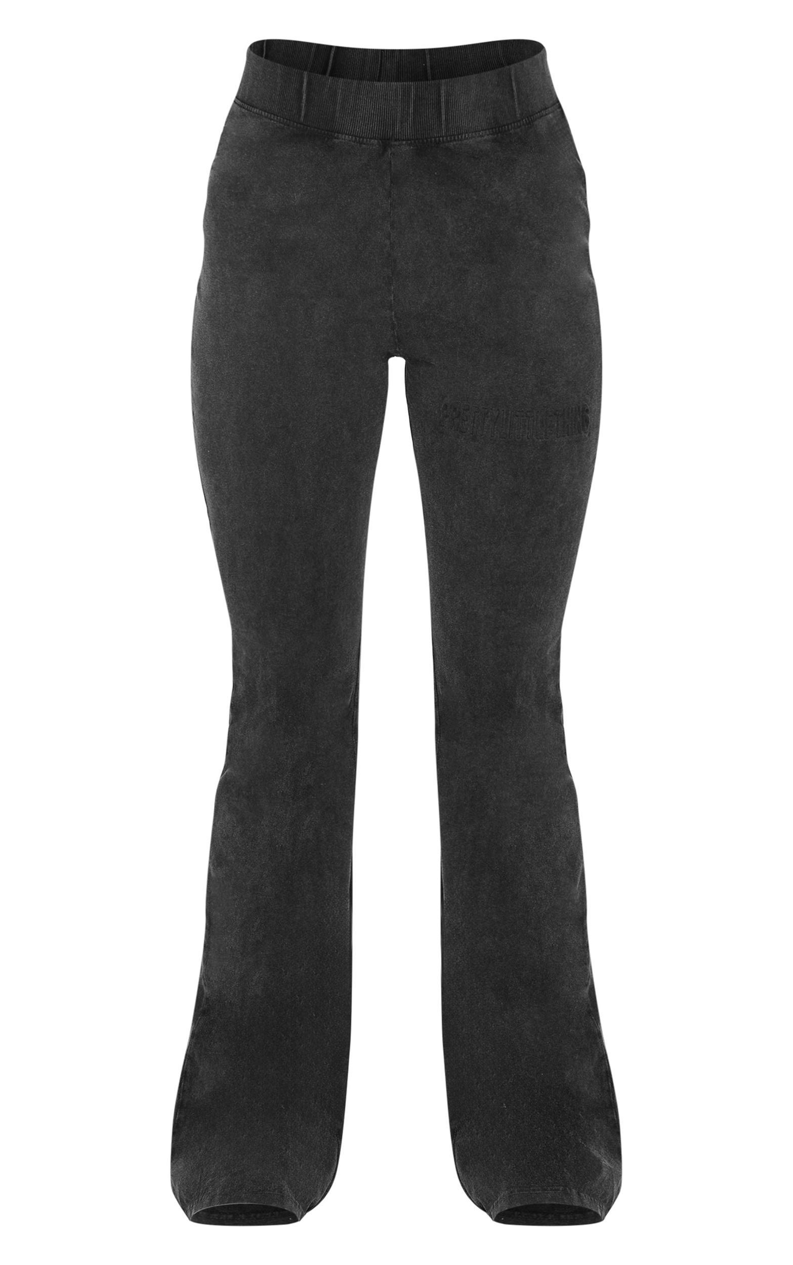 PRETTYLITTLETHING Black Embossed Logo Washed Skinny Flare Pants Product Image