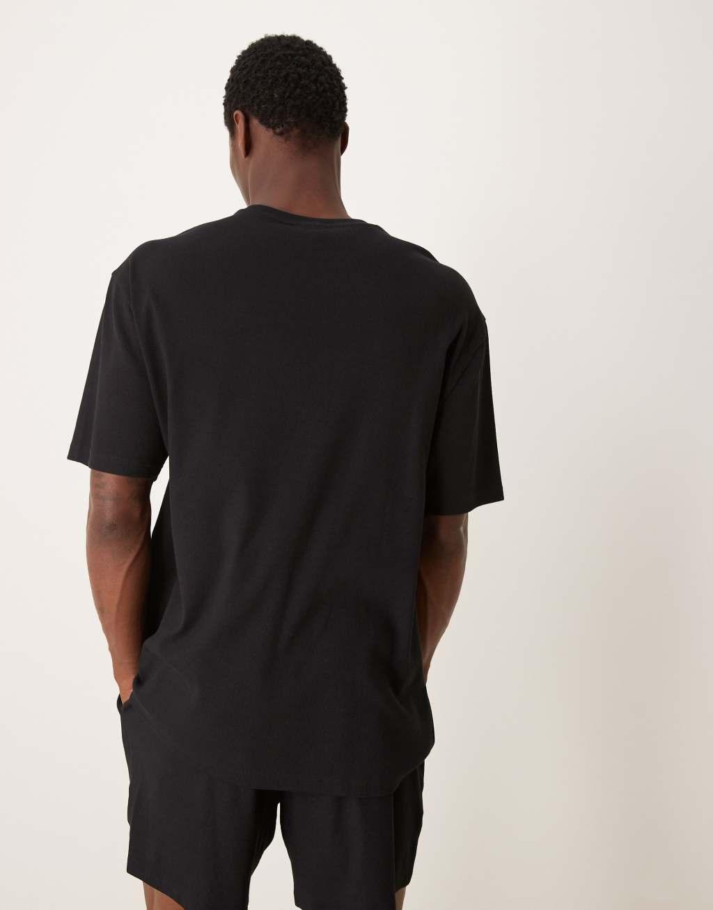 ASOS DESIGN capsule collection relaxed t-shirt and shorts lounge set in black Product Image