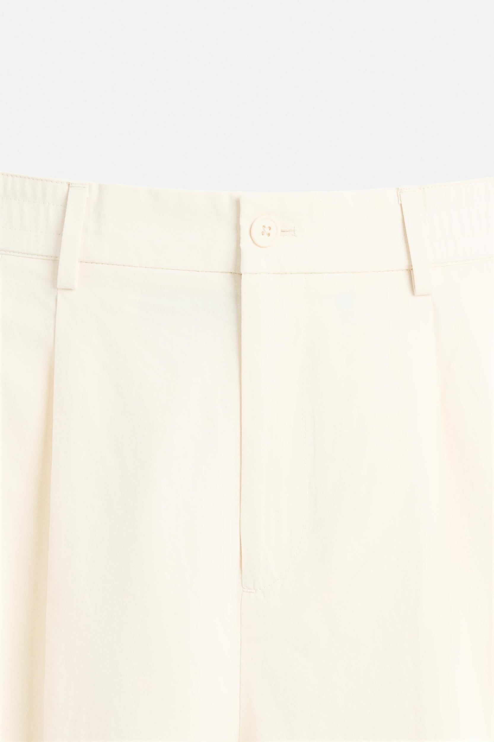 PLEATED CHINO PANTS Product Image