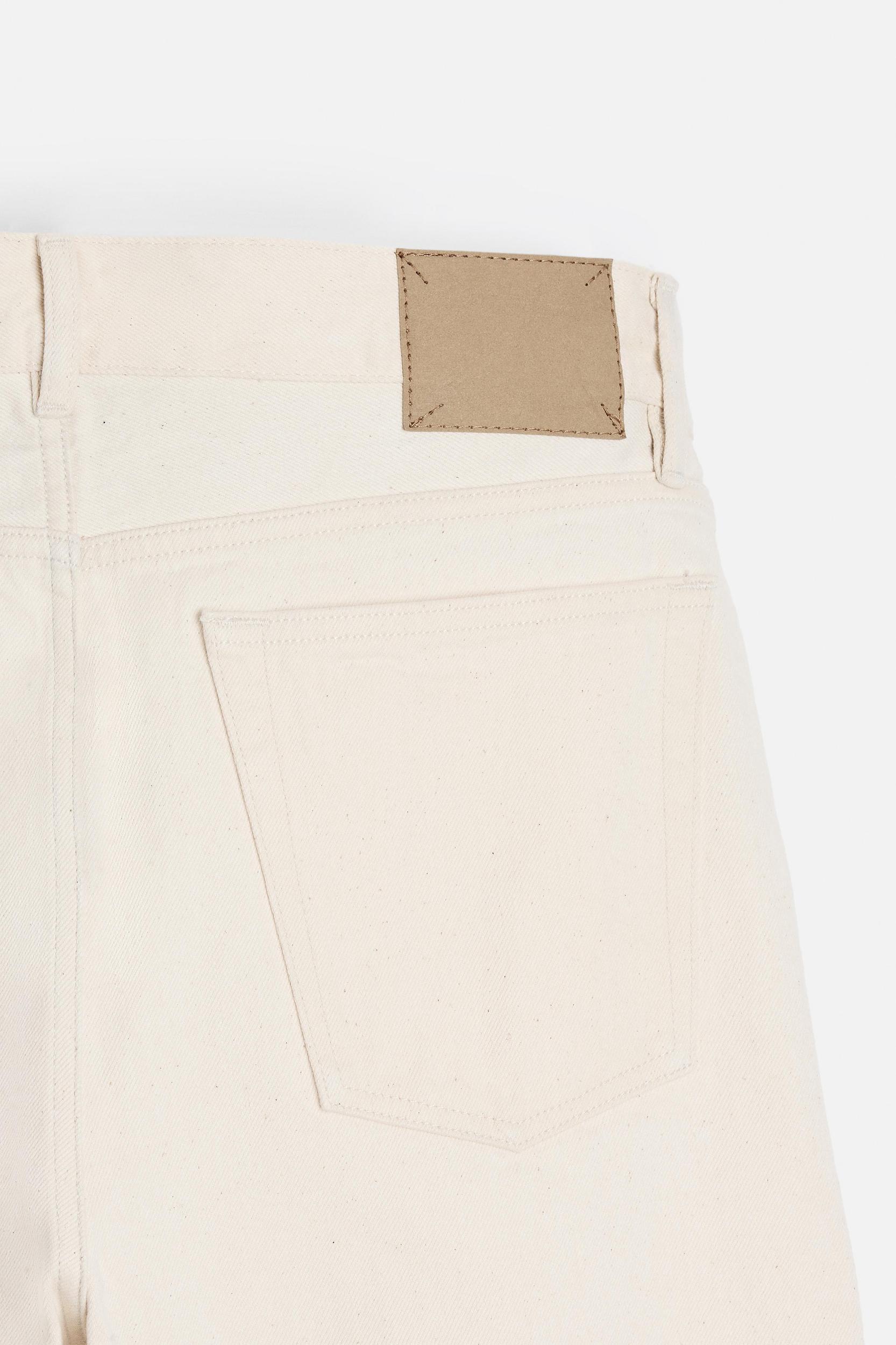 Slim fit jeans. Five pockets. Tonal topstitching. Front button closure.<br/><br/>Origins special collection. Product Image