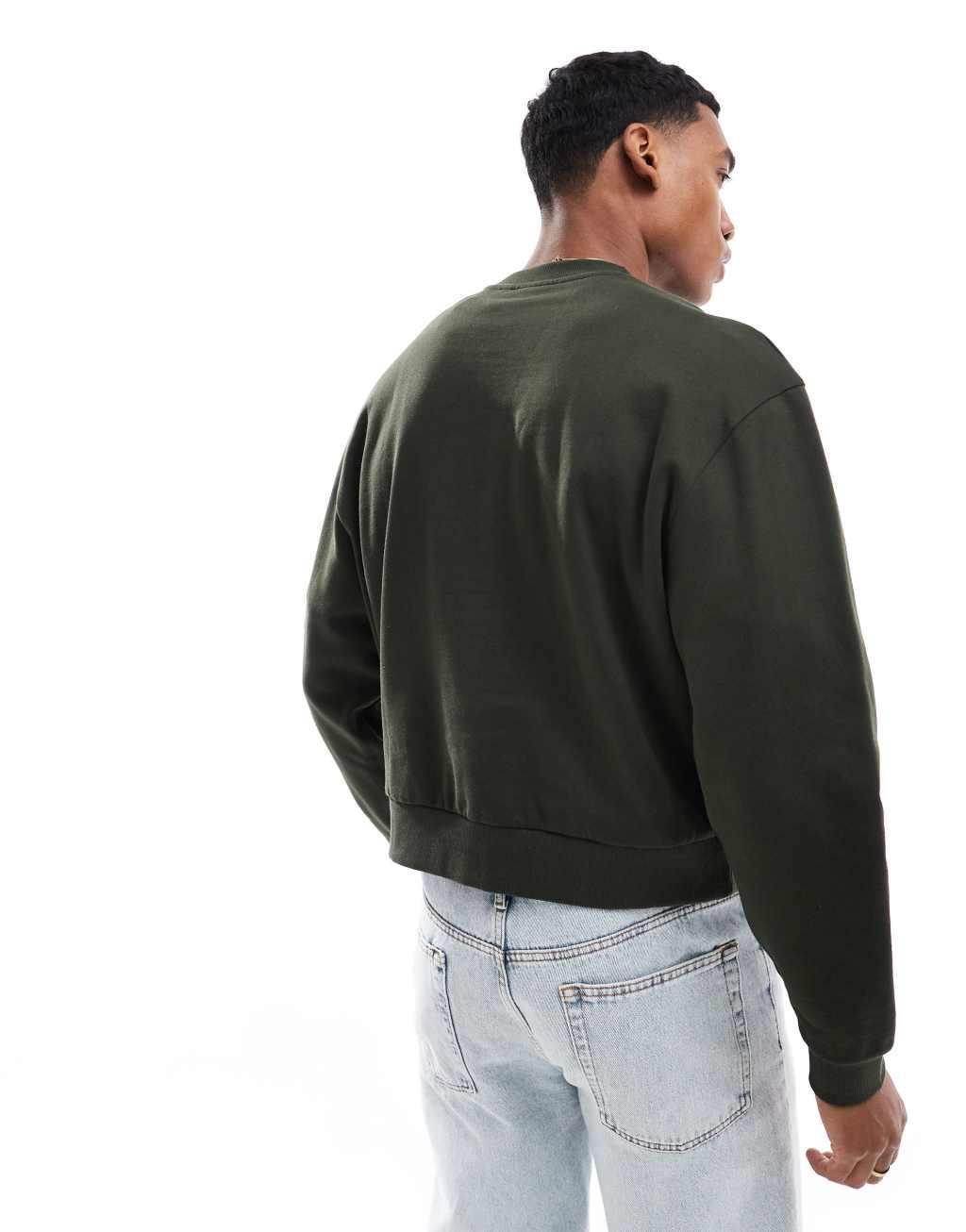 ASOS DESIGN oversized drop shoulder sweatshirt with studio ventures print in green Product Image