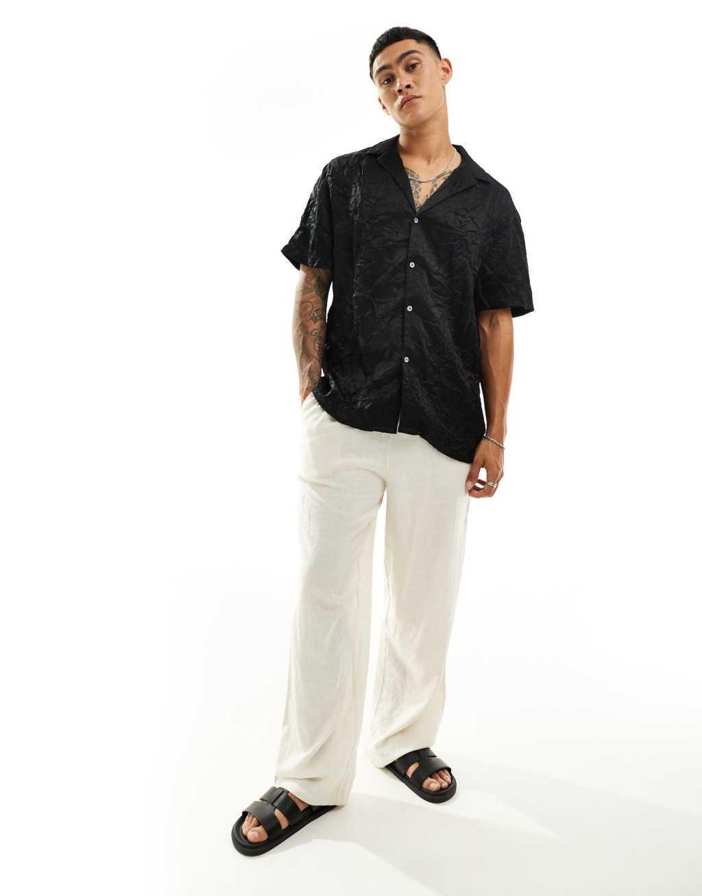 ASOS DESIGN short sleeve relaxed deep revere collar satin shirt in black Product Image