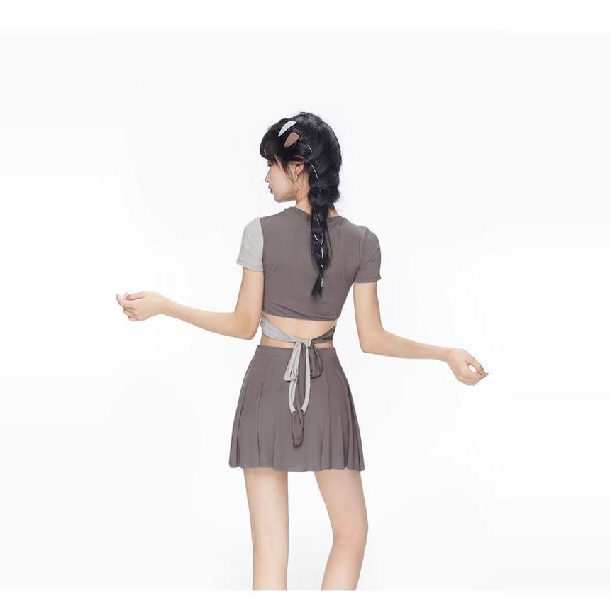 Set: Short Sleeve Crew Neck Two Tone Twist Swim Top + Bottom + Swim Skirt Product Image