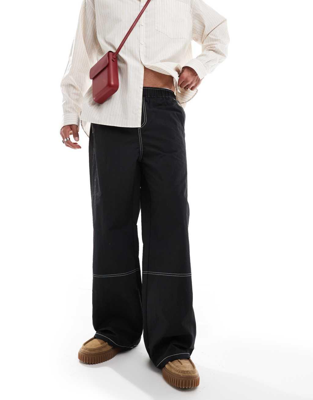 ASOS DESIGN baggy pants in black nylon with contrast stitch Product Image