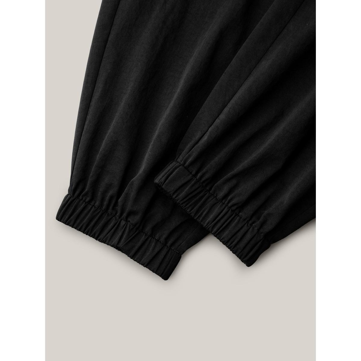 Plus Size Ruffled Waist Drawstring Tapered Pants Women Black Casual Mid Rise Everyday Pants BloomChic 22-24/3X Product Image