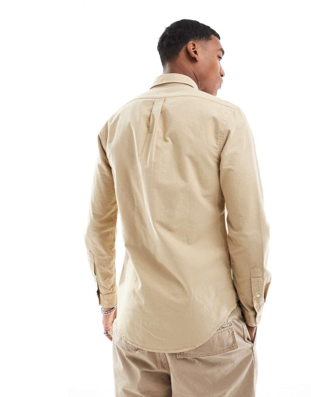 Polo Ralph Lauren icon logo slim fit garment dyed oxford shirt in beige Product Image