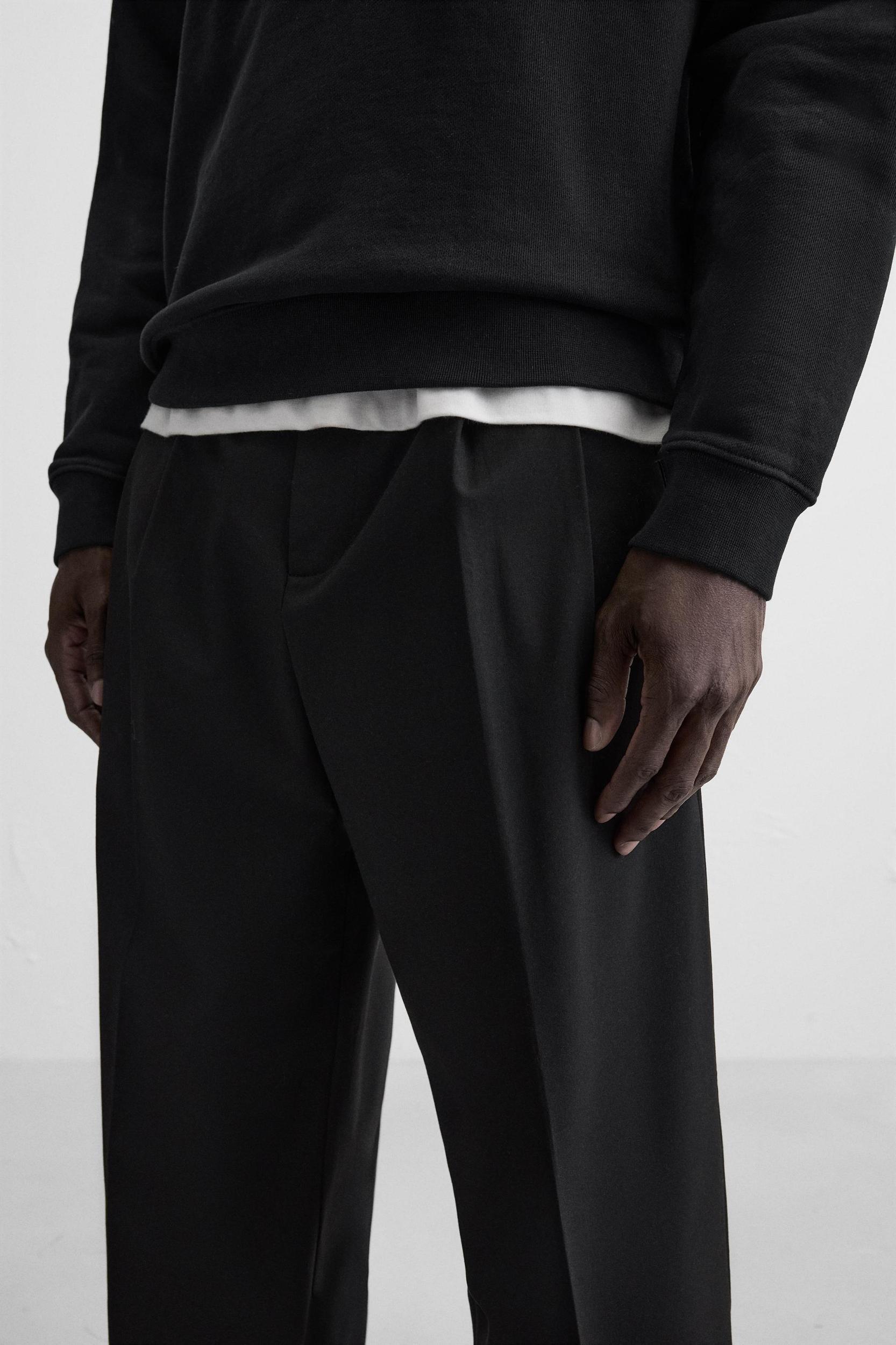PLEATED WIDE FIT PANTS Product Image