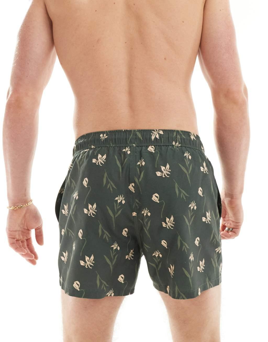 ASOS DESIGN swim shorts in short length in dark floral print Product Image