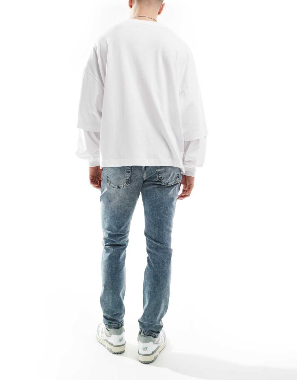 River Island skinny fit jeans in vintage midwash blue Product Image