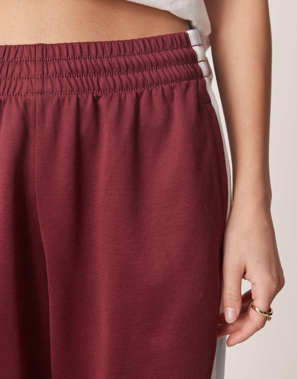 Abercrombie & Fitch mid rise drawstring track pants in red Product Image