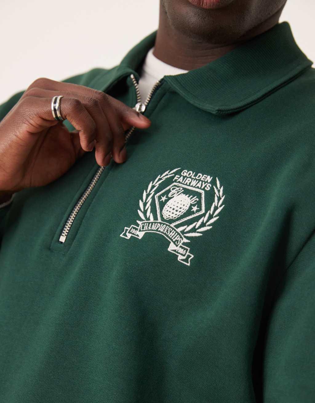 ASOS DESIGN boxy oversized polo shirt with tipping and embroidered chest print in green Product Image