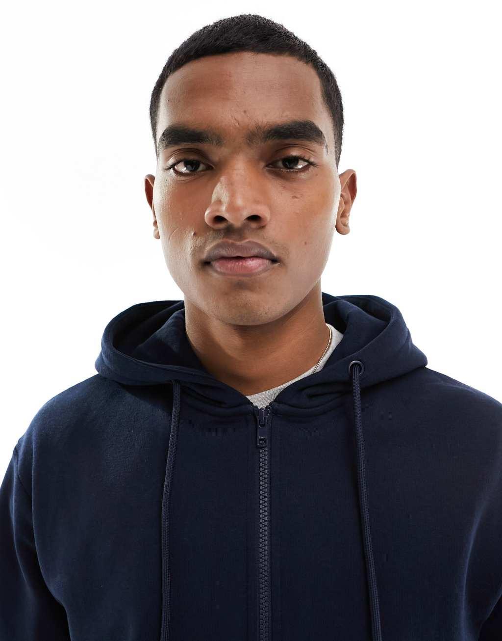 Jack & Jones zip up hoodie in navy Product Image
