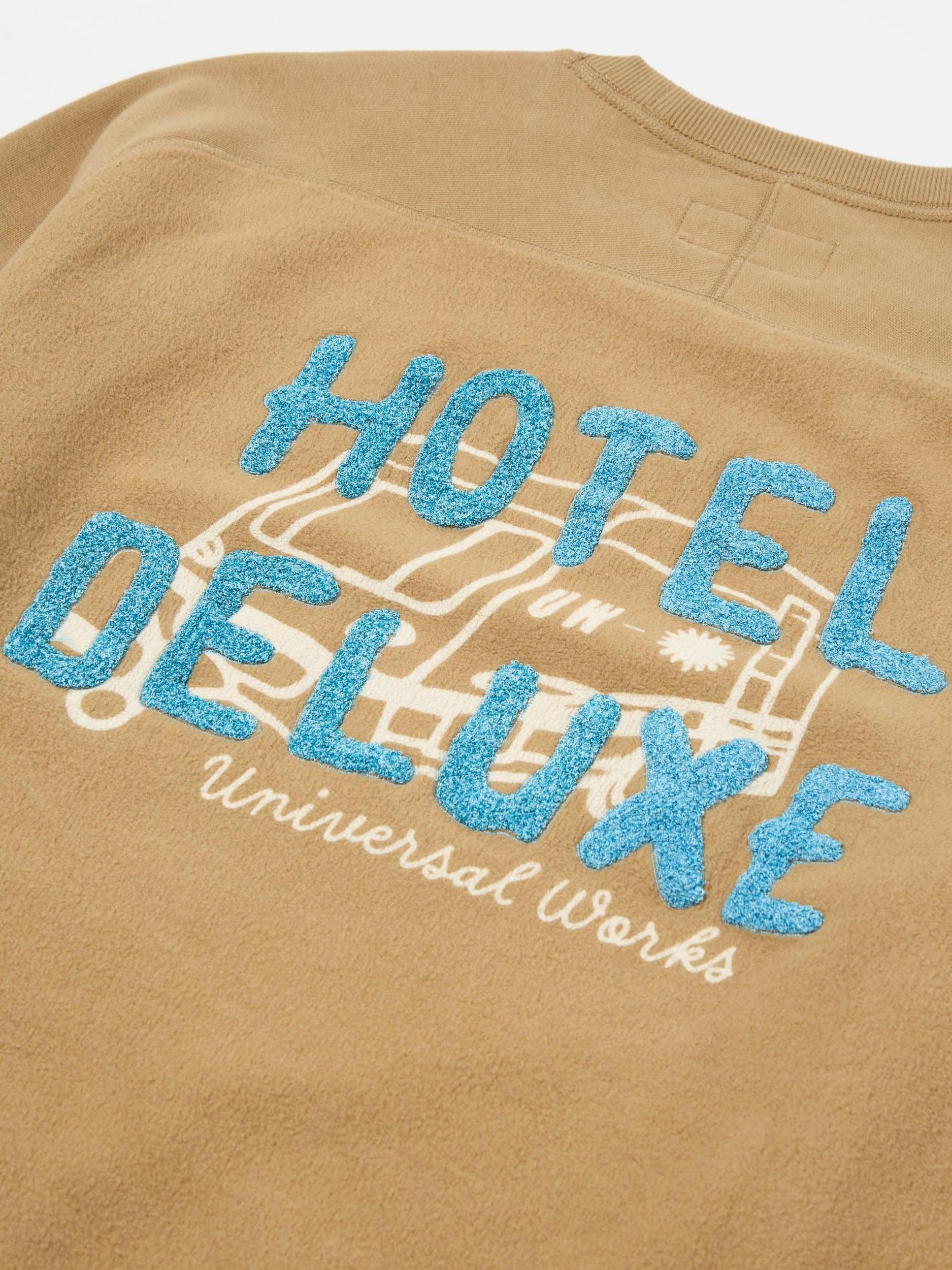 Universal Works Crew Sweat in Sand 'Hotel Deluxe' Embroidered Brush Back Product Image
