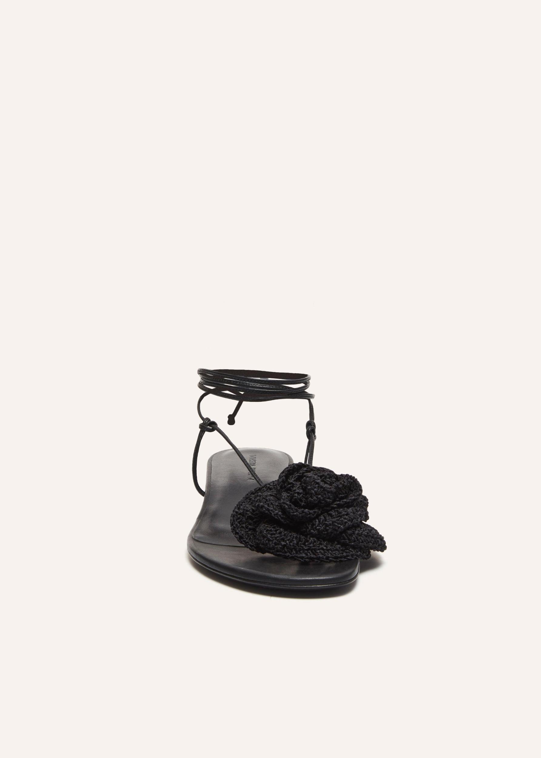Wrap around flat flower sandals in black crochet Product Image