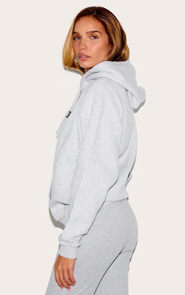 PRETTYLITTLETHING Ash Grey Logo Badge Detailed Oversized Hoodie Product Image