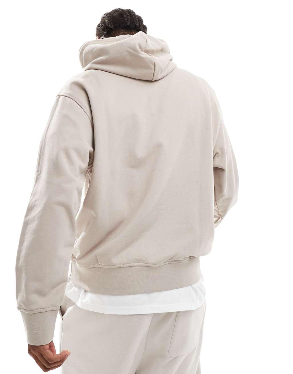 Armani Exchange contrast chest logo hoodie in beige Product Image