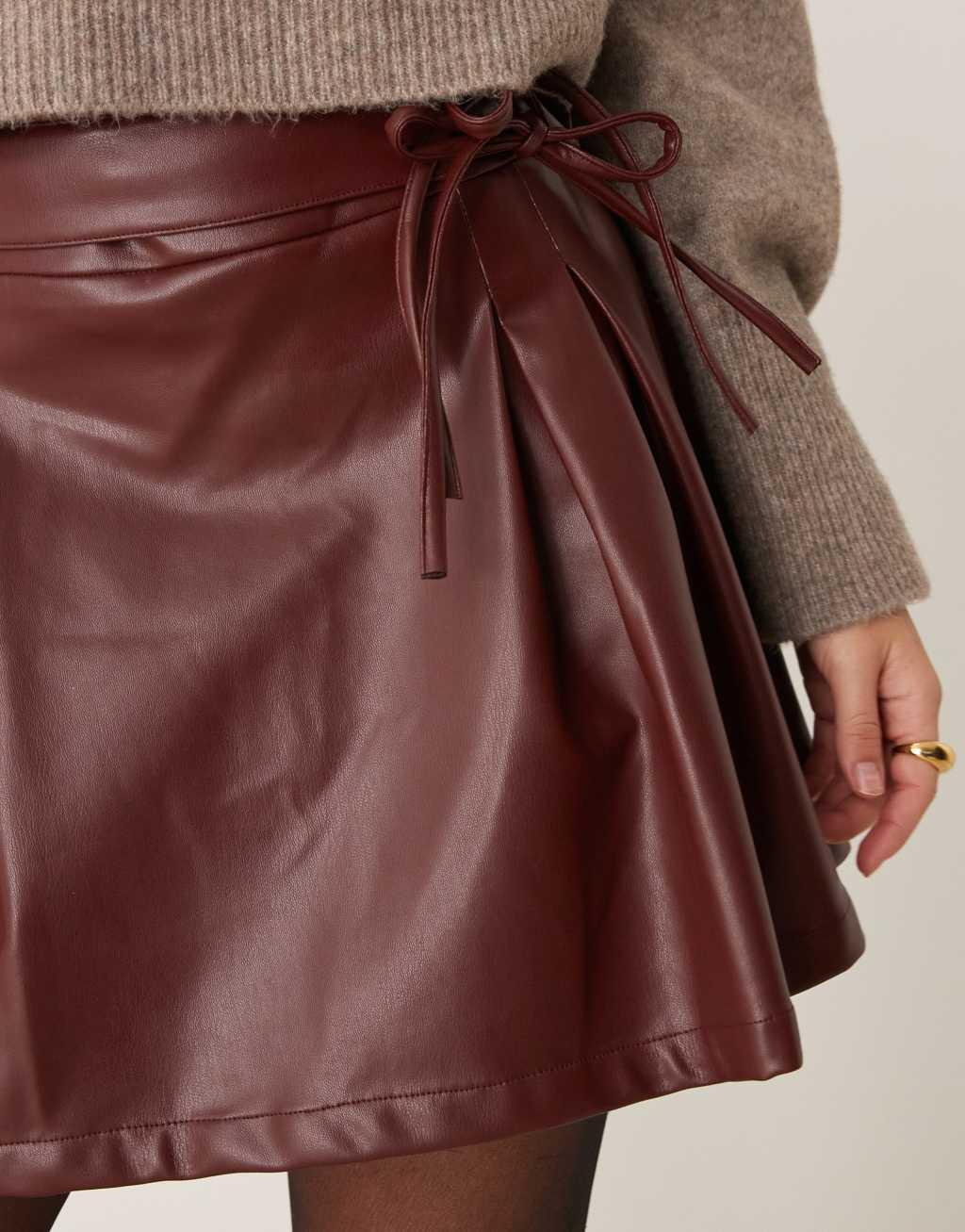 ASOS DESIGN leather look pleated mini skirt in burgundy Product Image