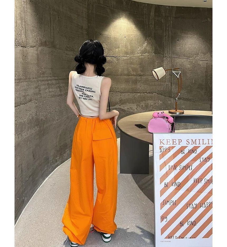 Round Neck Lettering Print Crop Tank Top / Drawstring Waist Plain Wide Leg Cargo Pants Product Image