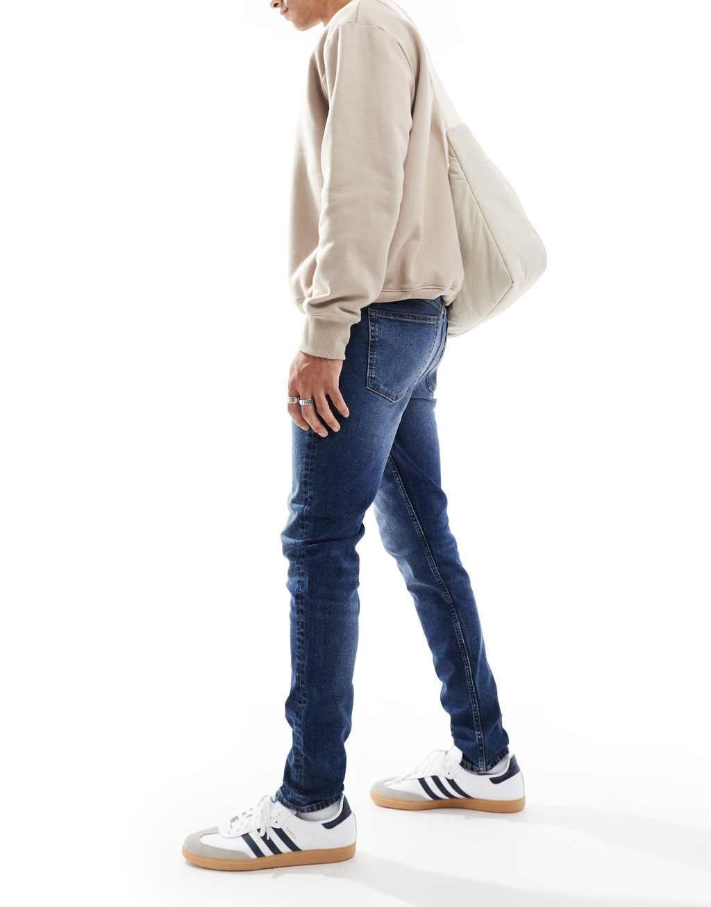 ASOS DESIGN skinny jeans in vintage dark wash Product Image