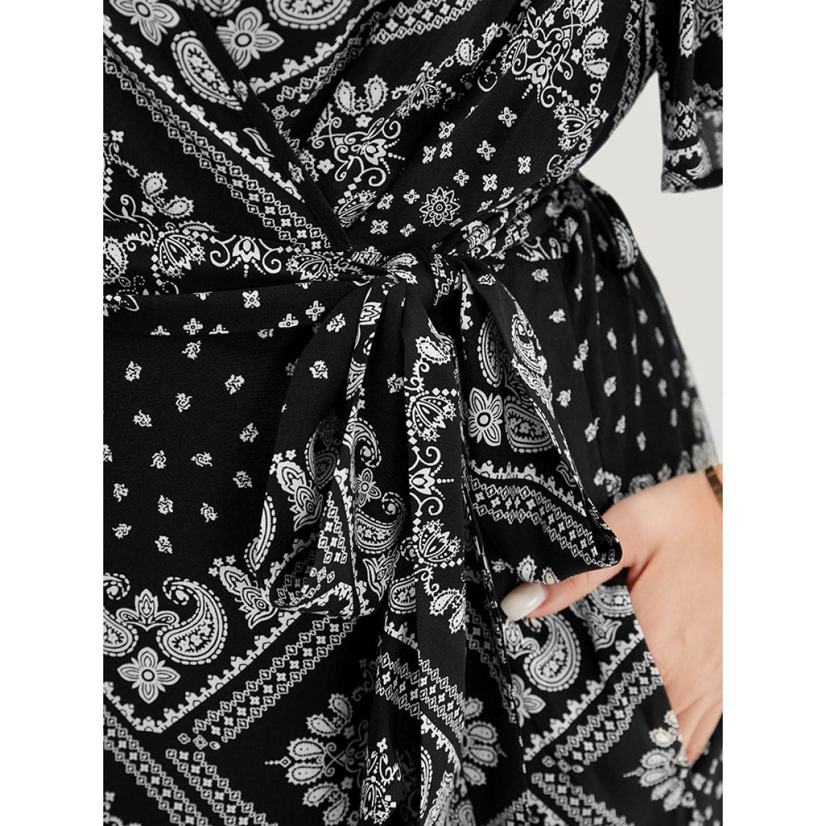 Plus Size Paisley Print Pocket Belted Wrap Flutter Sleeve Dress BlackFlower Women Vacation Wrap V-neck Short sleeve Curvy Knee Dress BloomChic 10/M Product Image