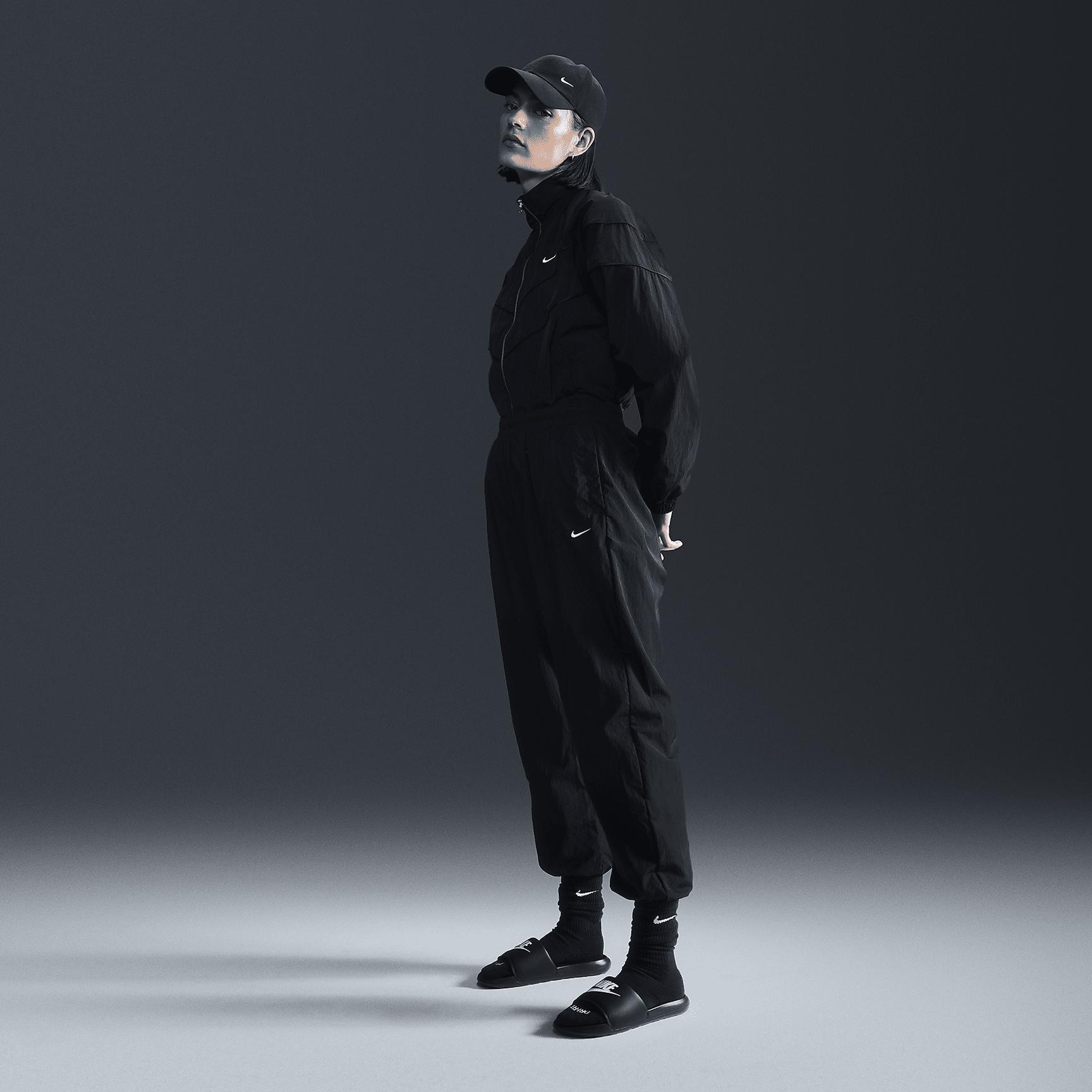 Women's Nike Sportswear Essential Mid-Rise Oversized Woven Jogger Pants Product Image