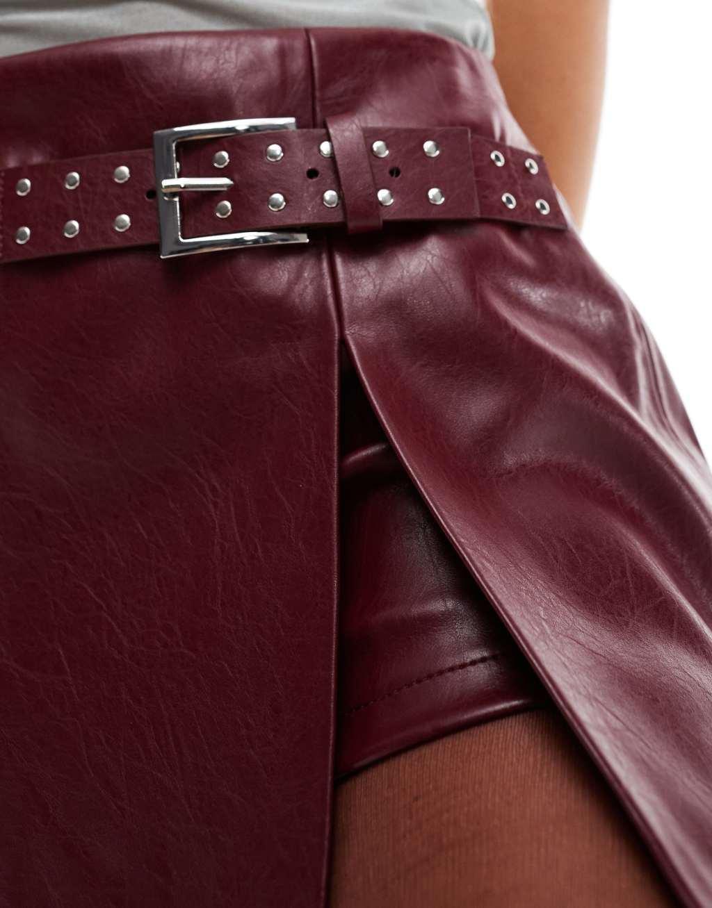 Bershka belted faux leather mini skirt in burgundy Product Image