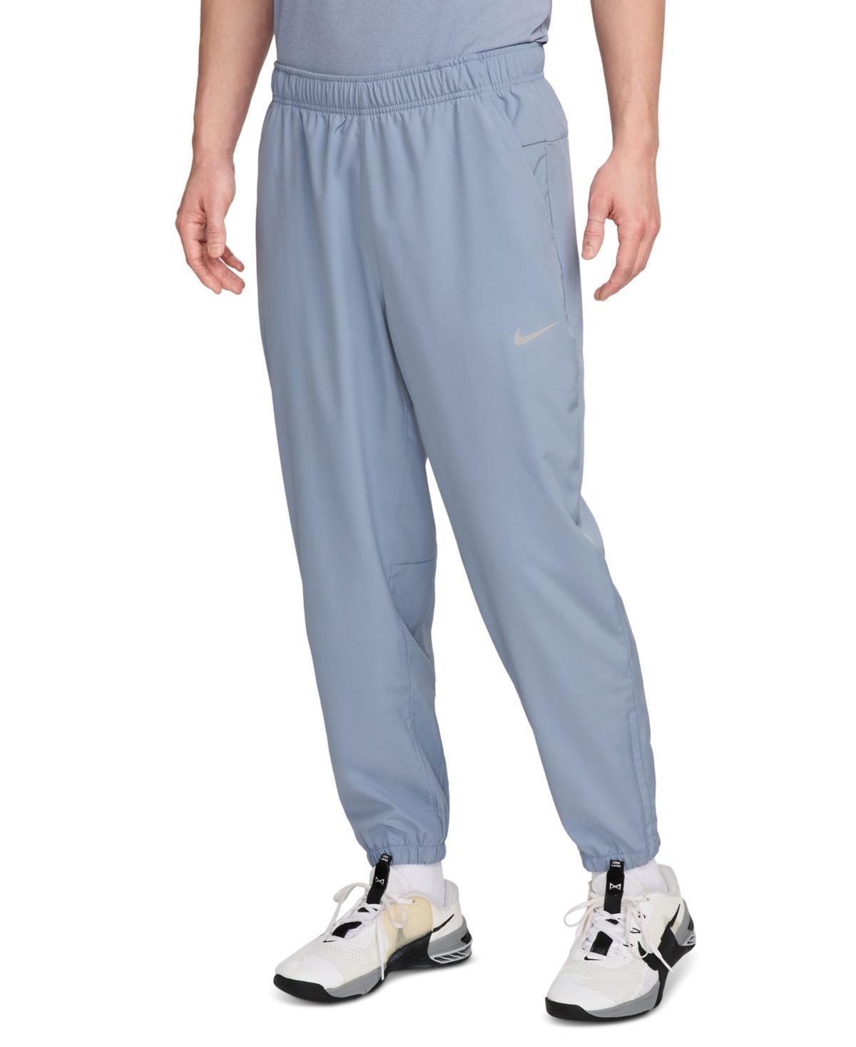 Nike Men's Form Dri-FIT Tapered Versatile Pants in Grey/Smoke Grey Size Large 100% Polyester Product Image