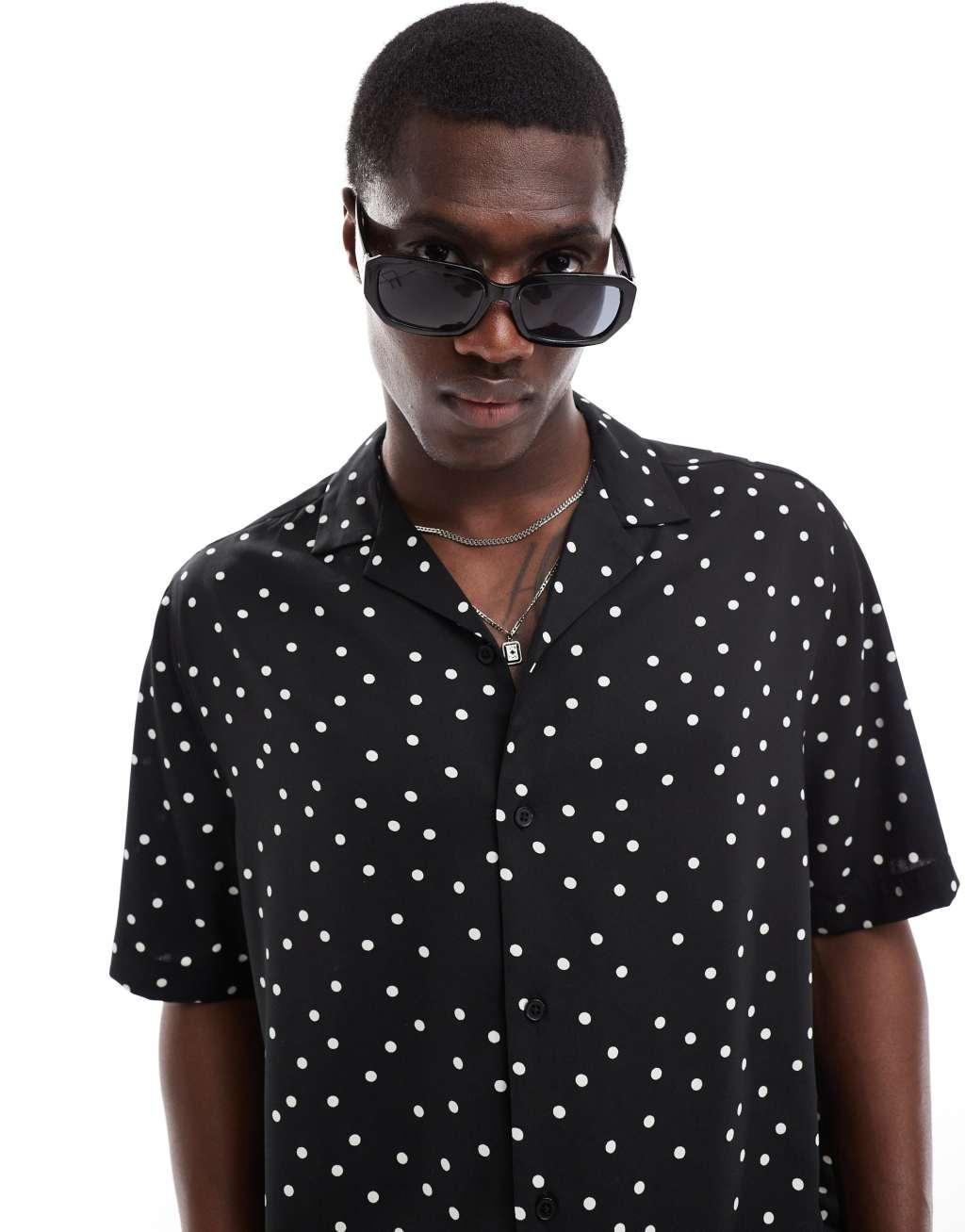 ASOS DESIGN relaxed revere shirt with polka dot print in black Product Image