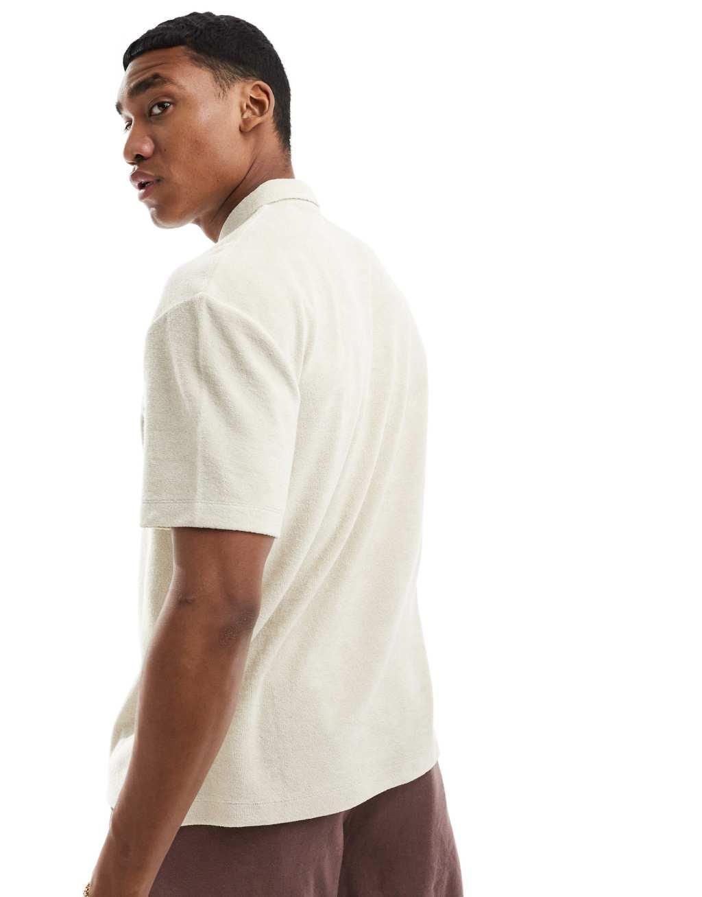 ASOS DESIGN relaxed polo shirt in beige terrycloth with embroidery Product Image