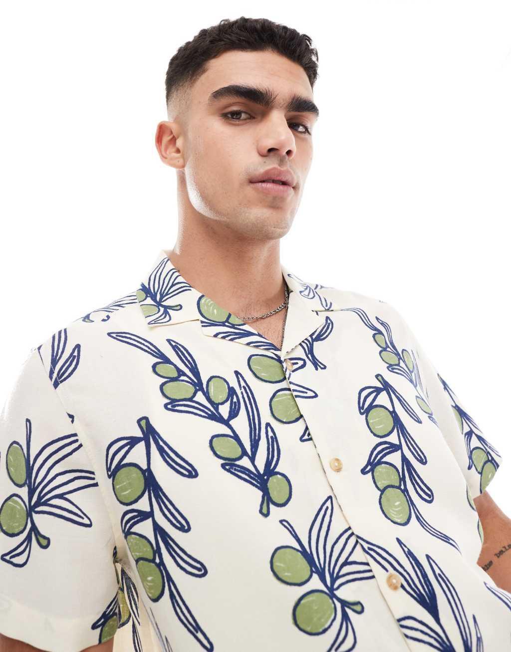 ASOS DESIGN relaxed camp collar shirt with leaf and fruit print in cream Product Image