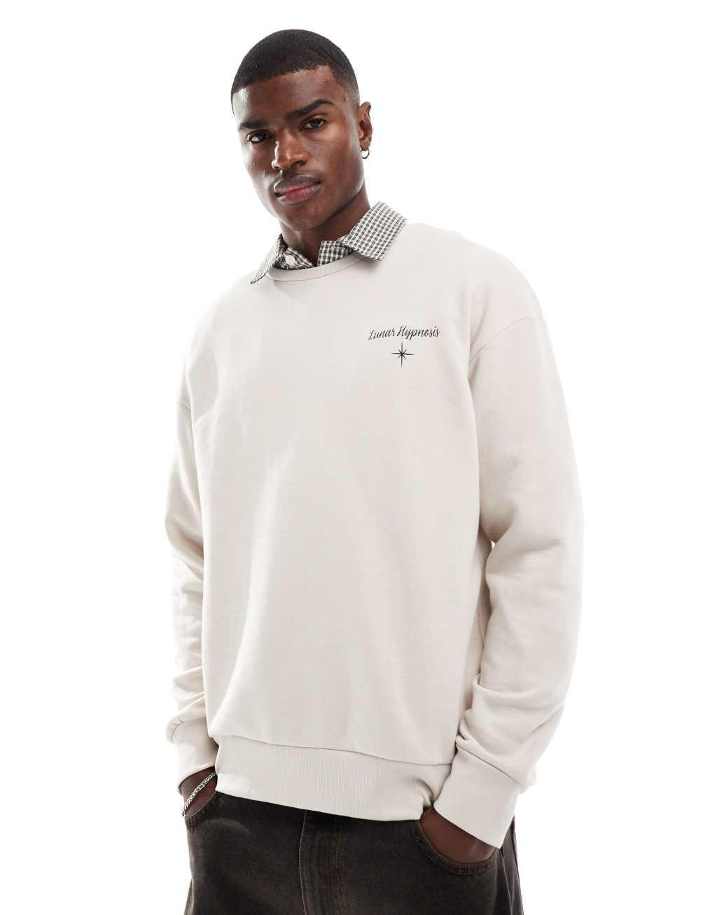 Jack & Jones drop shoulder crew neck sweat with celestial back print in beige Product Image