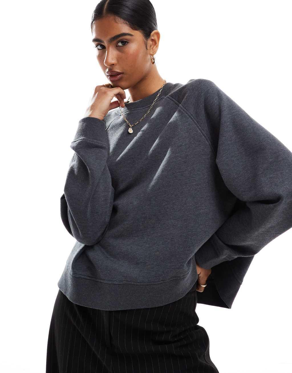 ASOS DESIGN oversized sweat with raglan detail in black Product Image