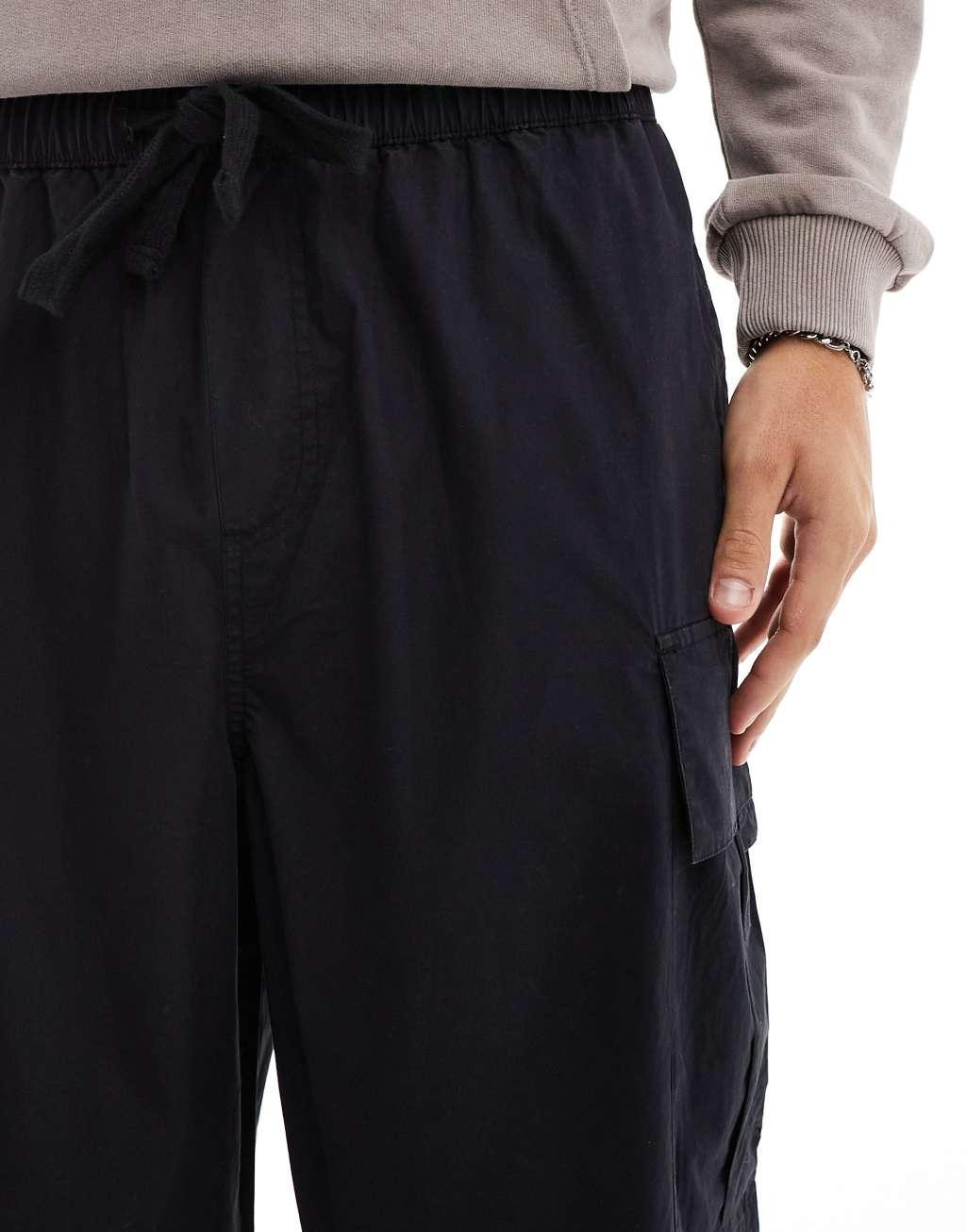 Another Influence wide leg parachute cargo pants in black Product Image