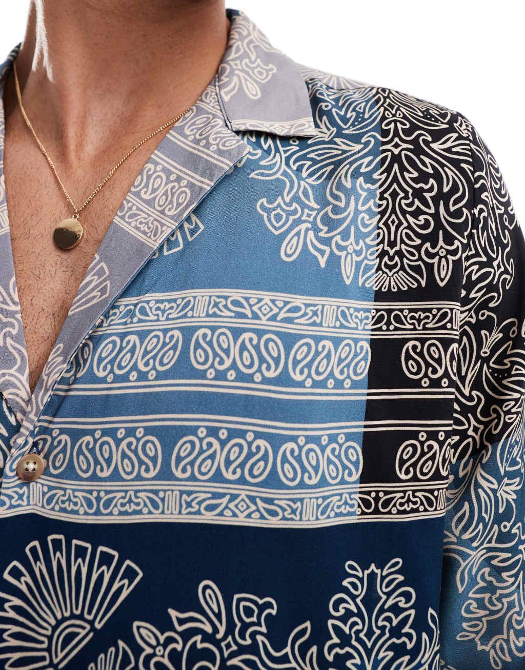 ASOS DESIGN relaxed deep revere shirt in spliced bandana print in blue  Product Image