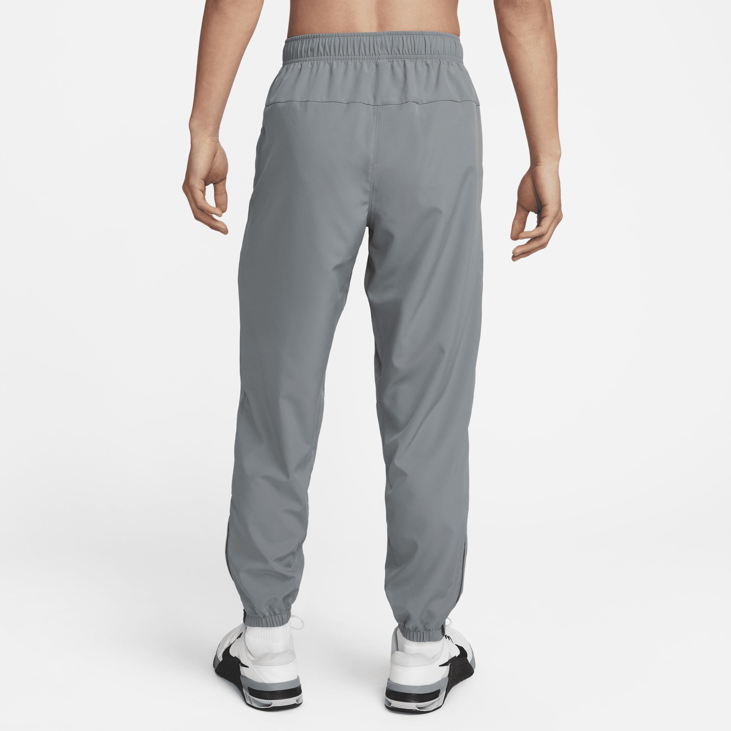 Nike Men's Form Dri-FIT Tapered Versatile Pants in Grey/Smoke Grey Size Large 100% Polyester Product Image