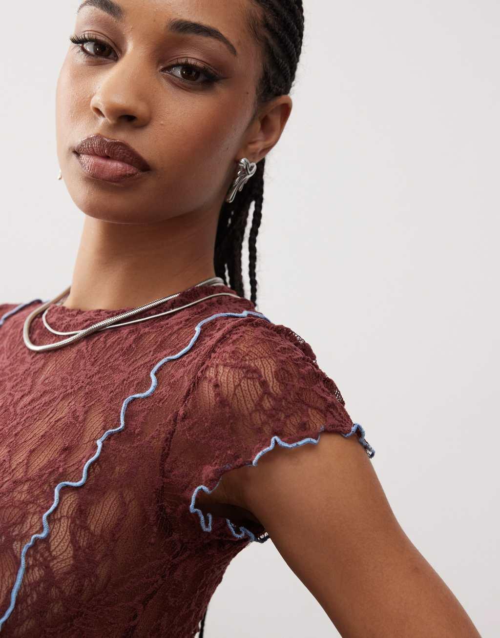 COLLUSION cap sleeve lace top in brown with contrast blue seam Product Image