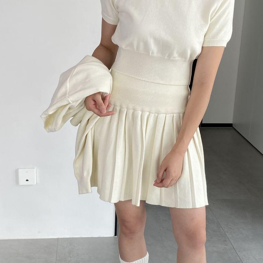 Set: Short-Sleeve Round Neck Plain Knit Top + Mid Waist Plain Mini Pleated Skirt + Round Neck Button Cardigan Product Image