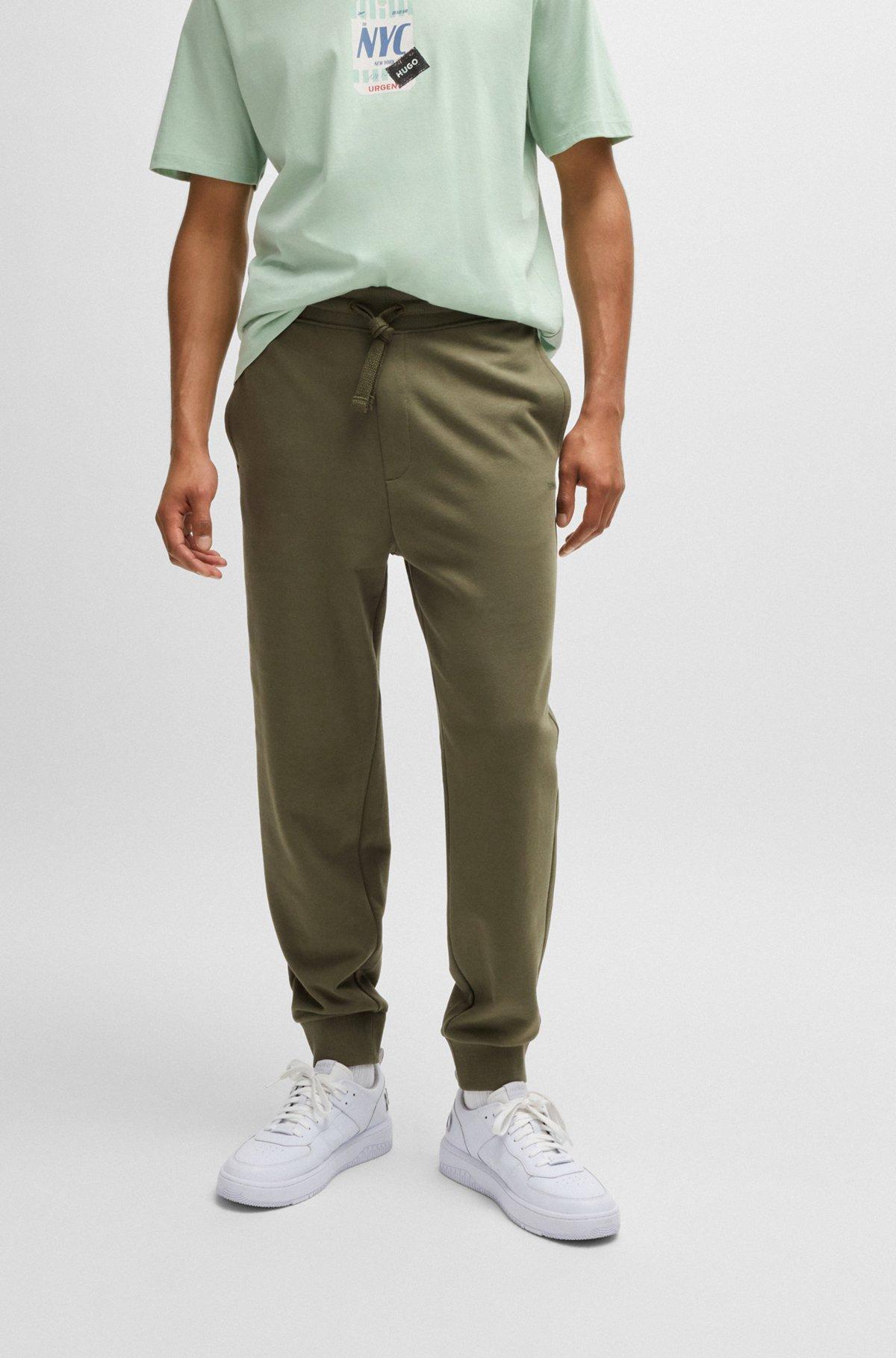 Cotton-terry tracksuit bottoms with logo print Product Image