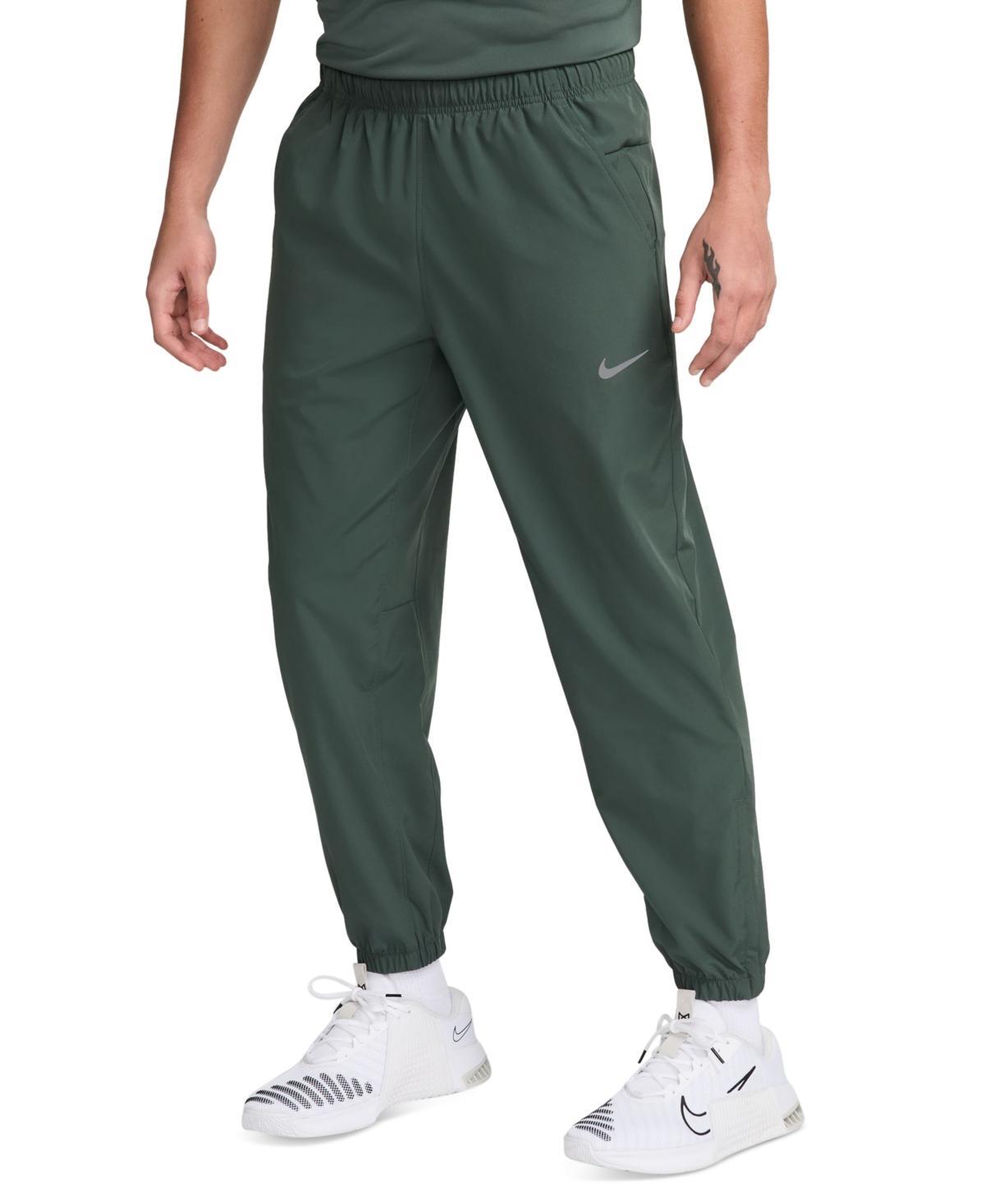 Nike Men's Form Dri-FIT Tapered Versatile Pants in Grey/Smoke Grey Size Large 100% Polyester Product Image