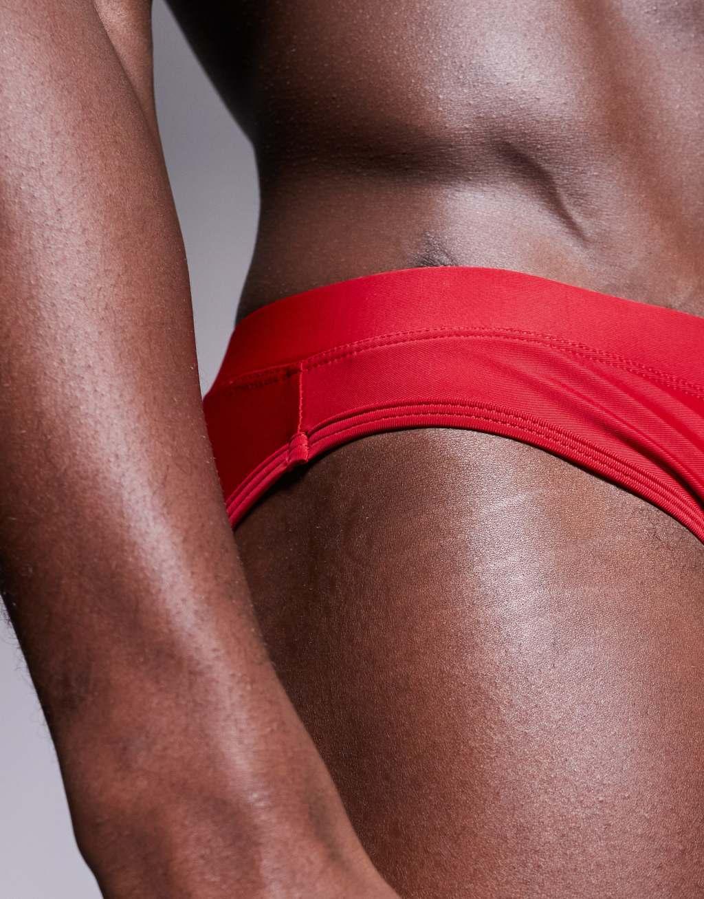 ASOS DESIGN swim briefs in red Product Image