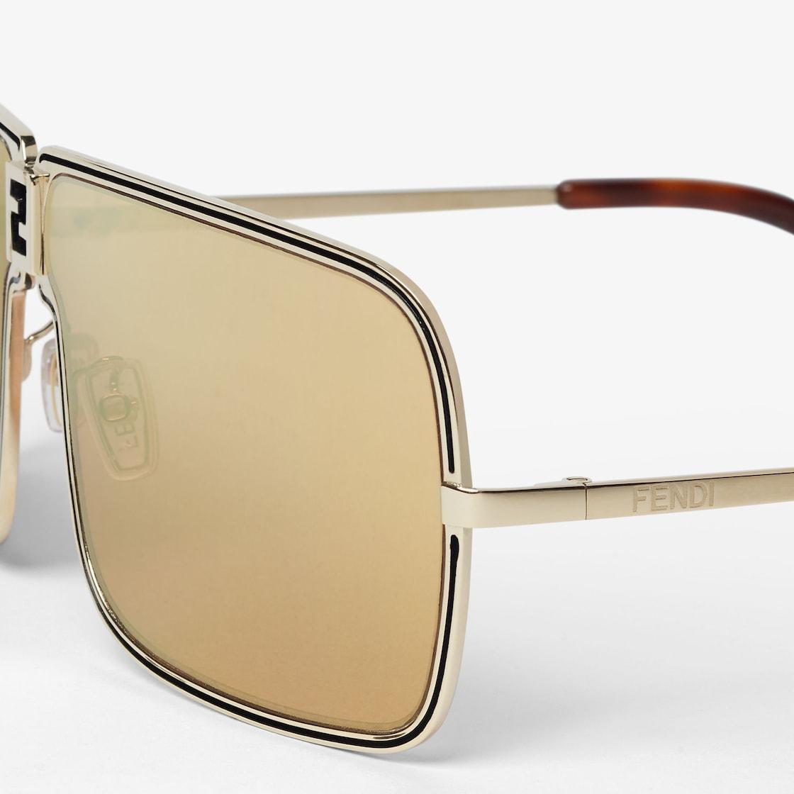 FendinessGold metal sunglasses with orange lenses with gold flash Product Image