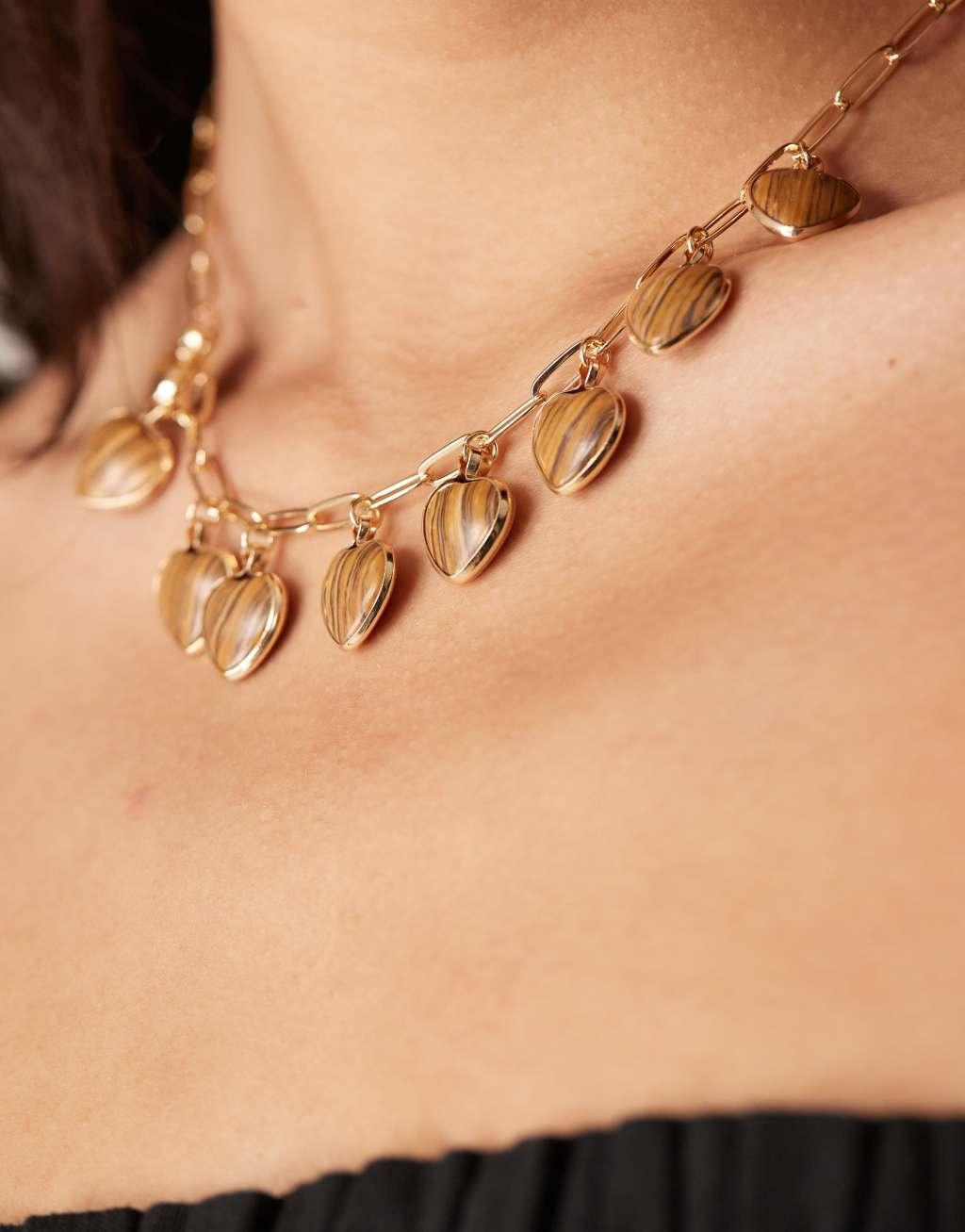 ASOS DESIGN necklace with faux tigers eye heart charms in gold tone Product Image