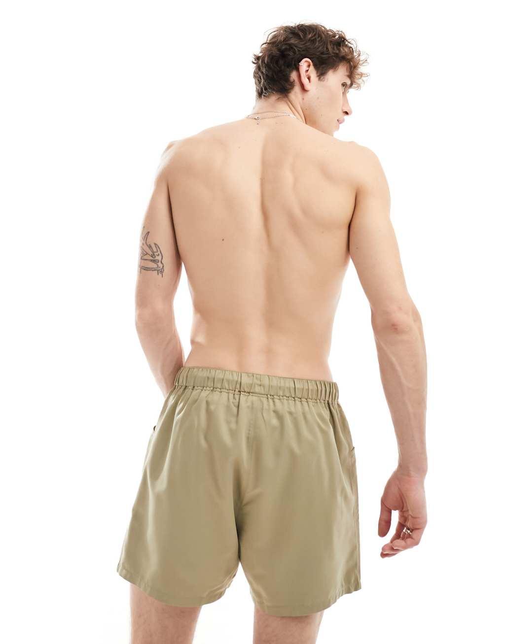 ASOS DESIGN swim shorts in short length with cargo pockets in green  Product Image