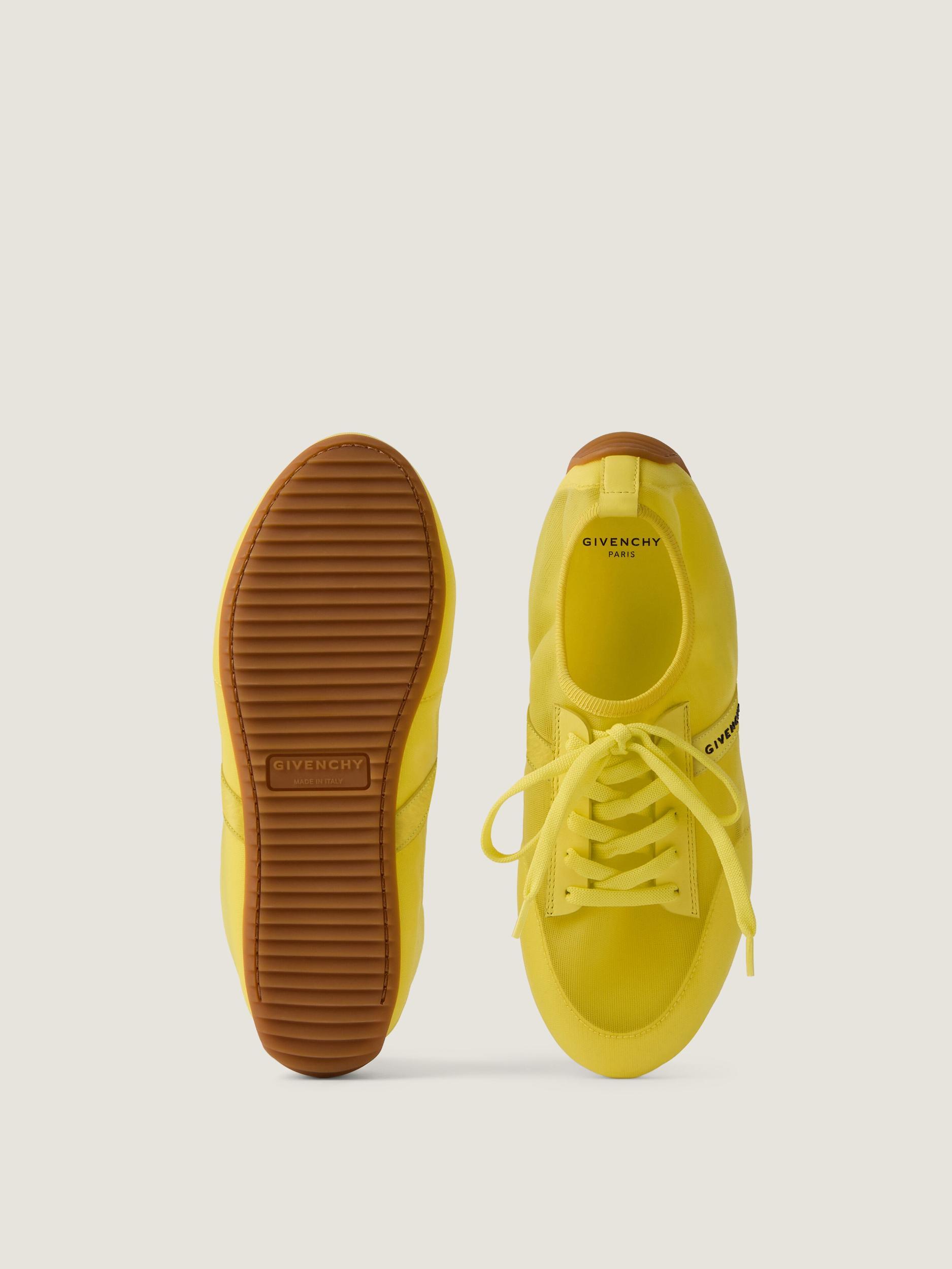 Slim sneakers in transparent mesh and leather Product Image
