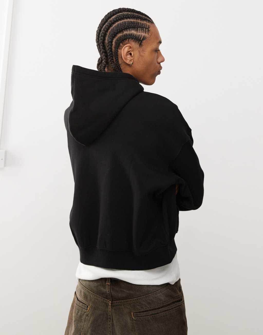 Weekday oversized zip through hoodie with spikey embroidered graphic in black Product Image