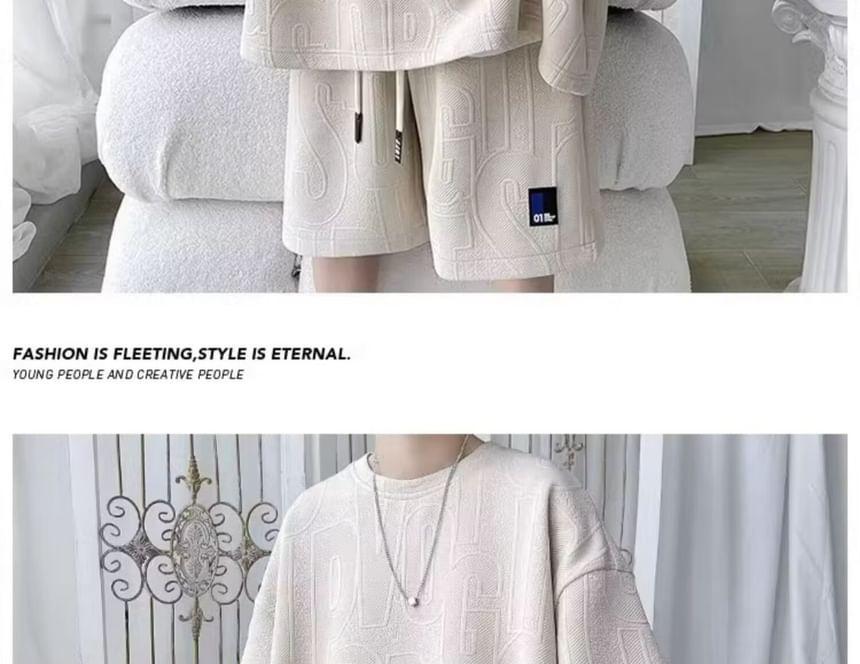 Set: Elbow-Sleeve Crew Neck Lettering Embossed Applique T-Shirt + Drawstring Waist Sweat Shorts Product Image
