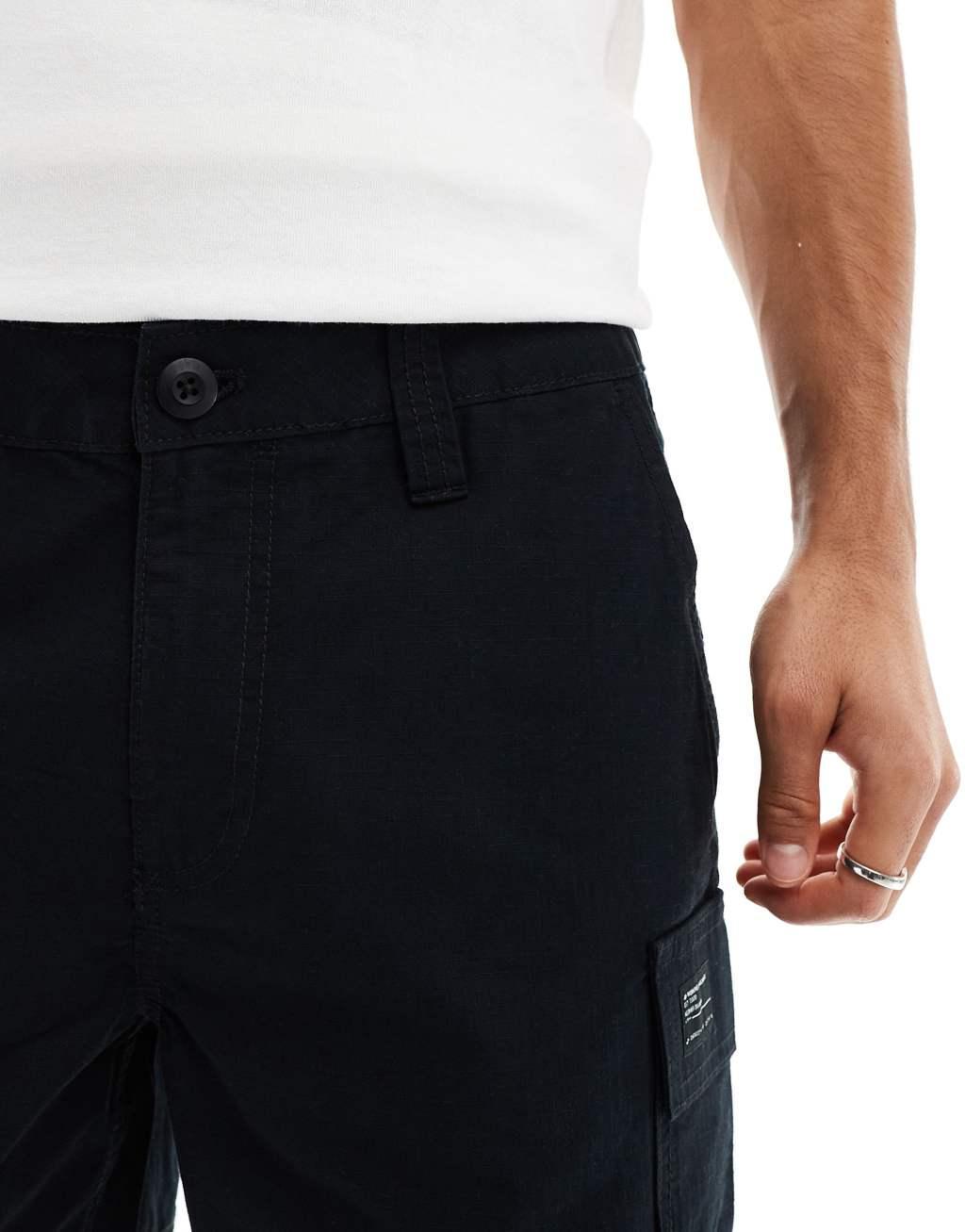 ASOS DESIGN slim cargo shorts with patch in black Product Image