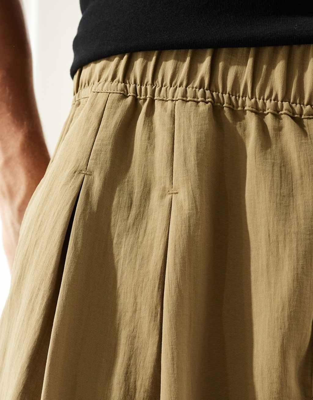 ASOS DESIGN oversized baggy chinos with pleats in khaki  Product Image